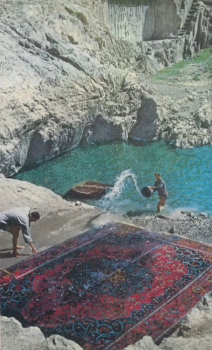 historic photo on the mountainside in the middle east two men washing a rug using natural water from a alpine lake to clean an antique Persian rug