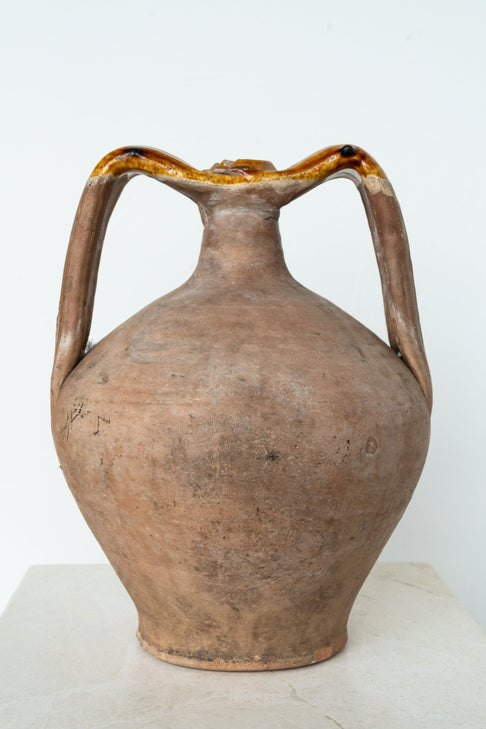 District Loom Italian terracotta amphora is an antique, hand-thrown piece with a strong body and seamlessly connected handles and spout