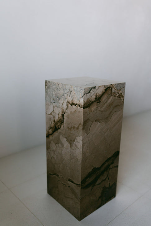 District Loom Furniture Illusion Bronze marble plinth pedestal locally sourced from natural marble stone slab remnants and handcrafted to serve as a sustainable sculptural element in your