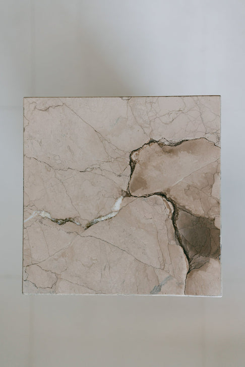 District Loom Furniture Illusion Bronze marble plinth pedestal locally sourced from natural marble stone slab remnants and handcrafted to serve as a sustainable sculptural element in your