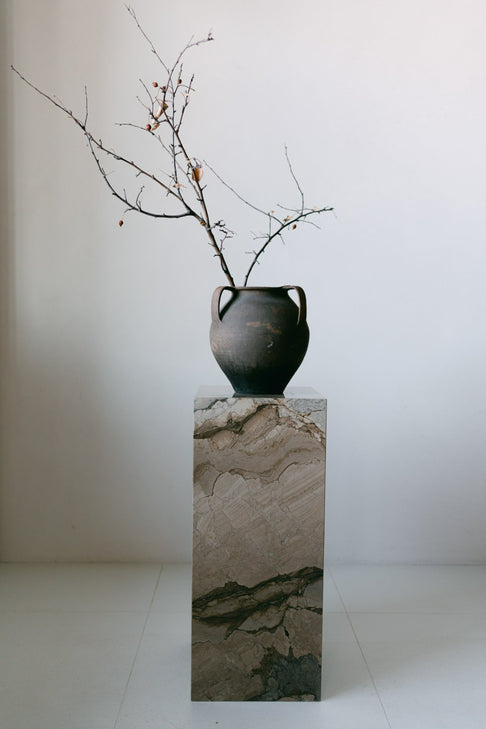 District Loom Furniture Illusion Bronze marble plinth pedestal locally sourced from natural marble stone slab remnants and handcrafted to serve as a sustainable sculptural element in your
