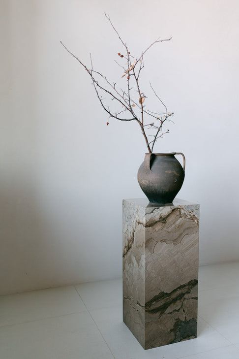 District Loom Furniture Illusion Bronze marble plinth pedestal locally sourced from natural marble stone slab remnants and handcrafted to serve as a sustainable sculptural element in your