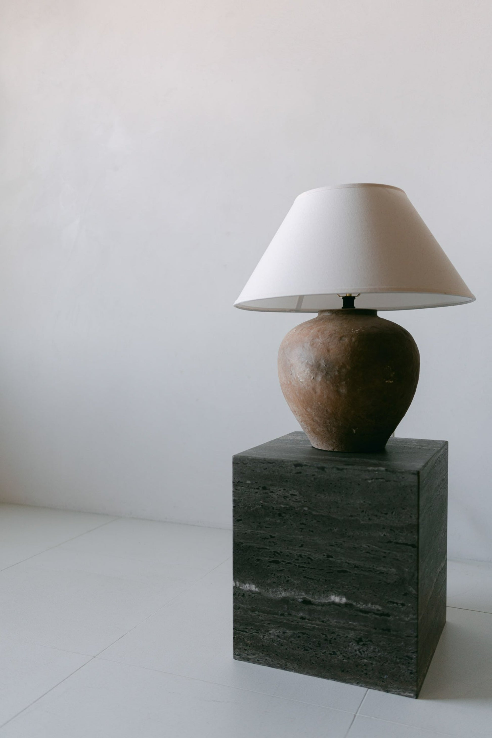 District Loom Furniture Ocean brown travertine plinth cube pedestal locally sourced from natural marble stone slab remnants and handcrafted to serve as a sustainable sculptural element in your home 008