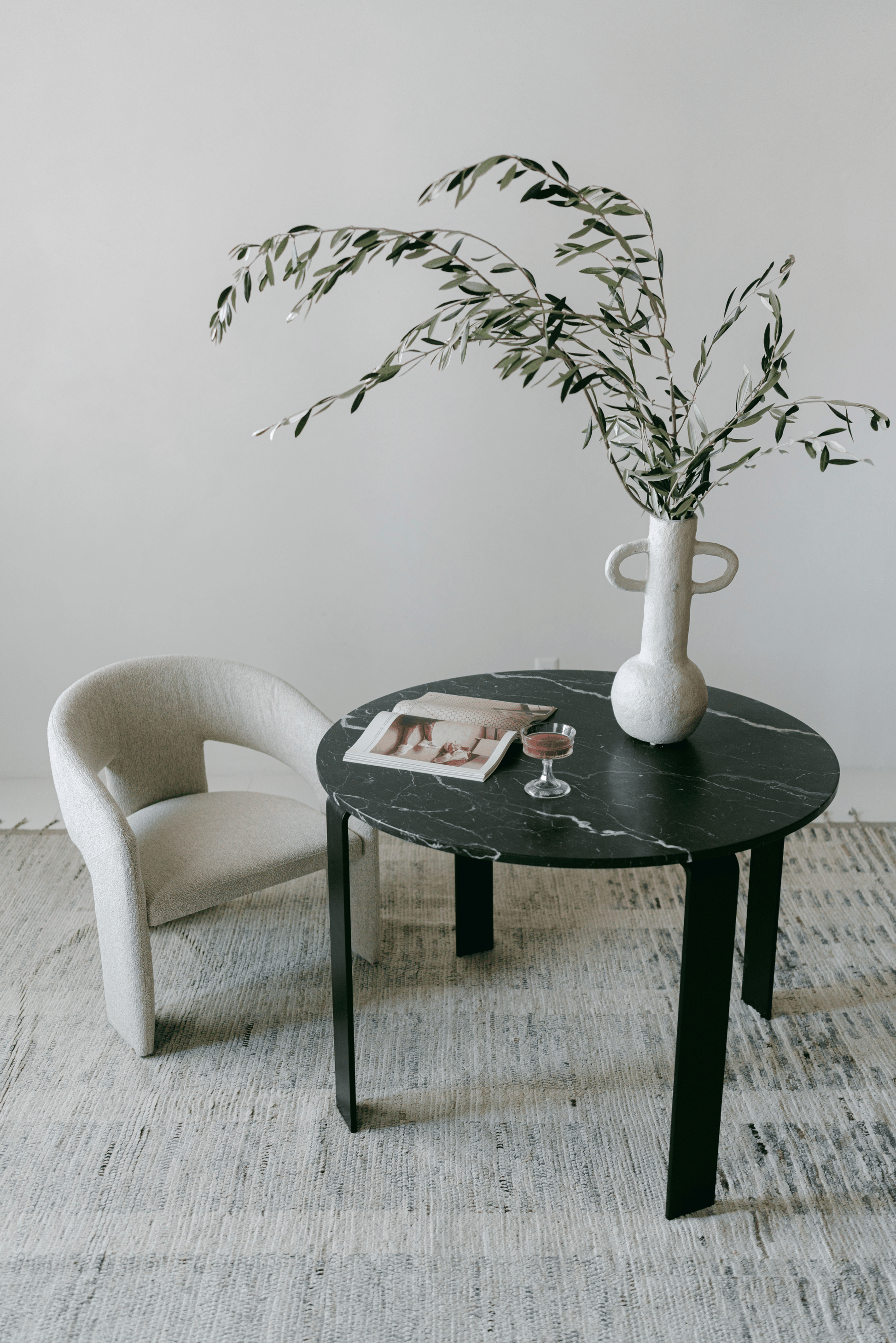 District Loom Furniture Nero Marquina Marble round table honed finish locally sourced from natural marble stone remnant and handcrafted to serve as a sustainable sculptural element in your home