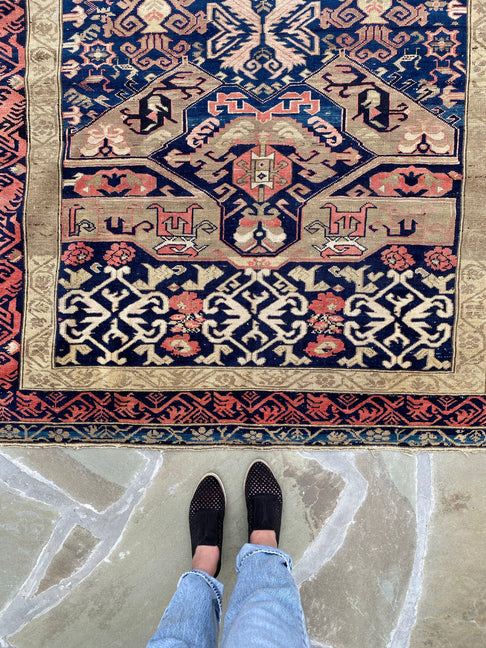 standing next to Antique Caucasian Zekhur Kuba